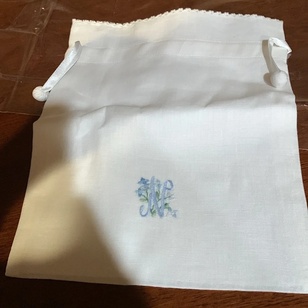 And beautiful hand made rare linen pouch with letter N hand dawn. Brand new!